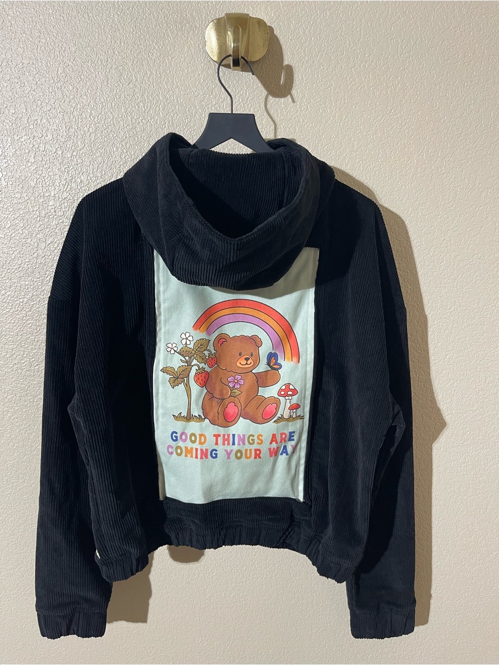 Swapwear Corduroy Black Hoodie with Rainbow Bear Graphic
